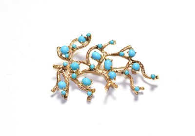 Lot 56 - An abstract brooch, set throughout with blue stones, unmarked, length 6.3cm
