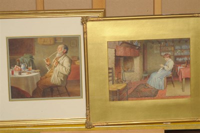 Lot 834 - Henry Spernon Tozer (1864-c.1938) Interior scene with a lady seated beside a fire place...