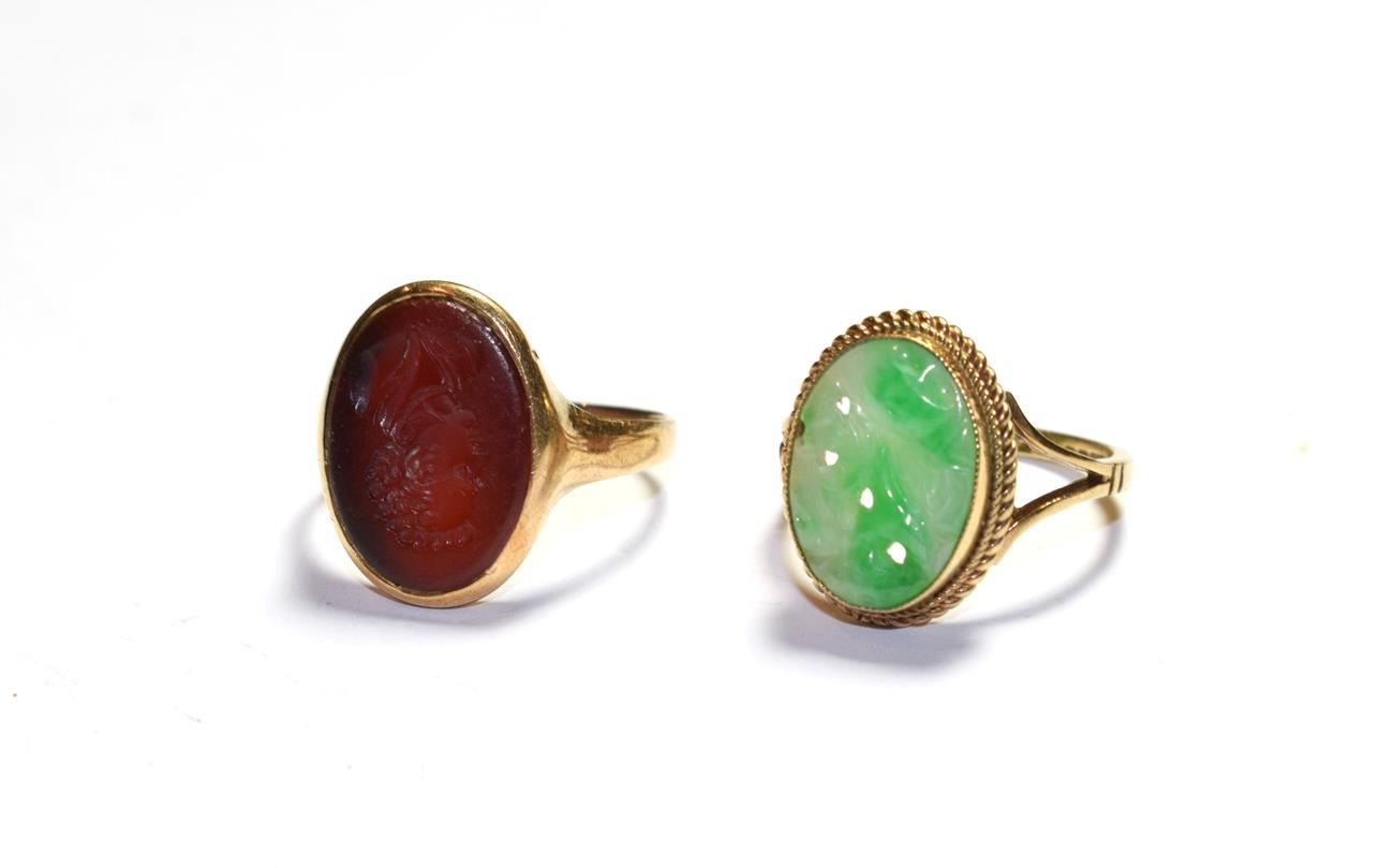 Lot 58 - A 9 carat gold jade ring, finger size M; and a cornelain intaglio ring, stamped '9CT', finger...