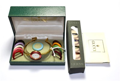 Lot 68 - A lady's interchangeable bezel Gucci wristwatch, signed Gucci, circa 1990, with Gucci box...