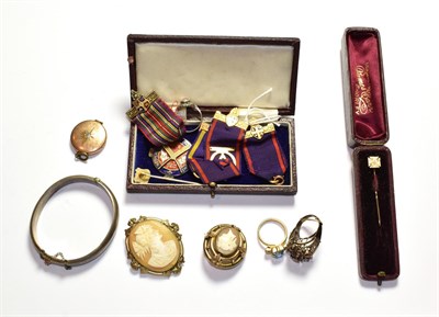 Lot 82 - A 9 carat gold stick pin; a silver bangle; two cameo brooches; costume jewellery including a locket