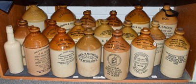 Lot 100 - Eighteen various stoneware flagons from mostly Sheffield; Wolverhampton and Dewsbury and a...