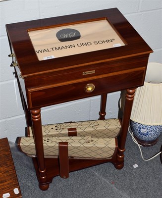 Lot 107 - A Waltmann und Sohn canteen table, containing a flatware service; with two sets of chefs' knives