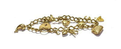 Lot 155 - A charm bracelet with a 9 carat gold padlock clasp hung with various charms including a boot, a...