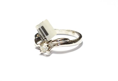 Lot 181 - A diamond solitaire ring, stamped '750', finger size P1/2