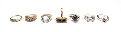Lot 193 - A 9 carat gold aquamarine ring, finger size N1/2; a tiger's eye ring, stamped '9KT', finger...