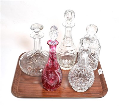 Lot 209 - Five various decanters including a cranberry example (5)