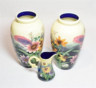 Lot 220 - A pair of Old Tupton ware floral decorated vases, 29cm high; and a similar jug (3)