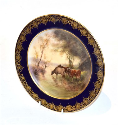 Lot 236 - A Royal Worcester hand-painted plate, by John Stinton, decorated with cattle watering and with...