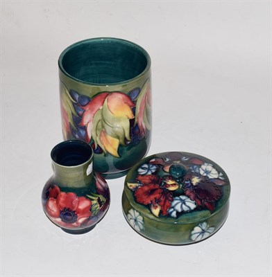 Lot 241 - Three pieces of Walter Moorcroft pottery, comprising a leaf and berry vase, 18.5cm high; a...