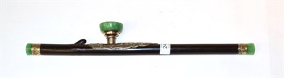 Lot 246 - A Chinese green hardstone and white metal mounted hardwood opium pipe, 48cm long, the metal...