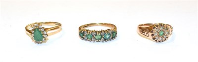 Lot 268 - Three 9 carat gold emerald and diamond dress rings, various designs and finger sizes