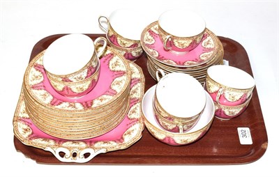 Lot 302 - A Royal Worcester pink and gilt part tea service