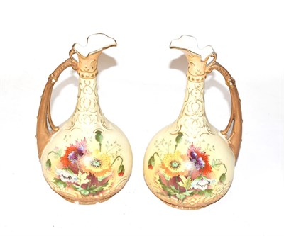 Lot 305 - A pair of Vienna porcelain floral painted ewers, 25cm high