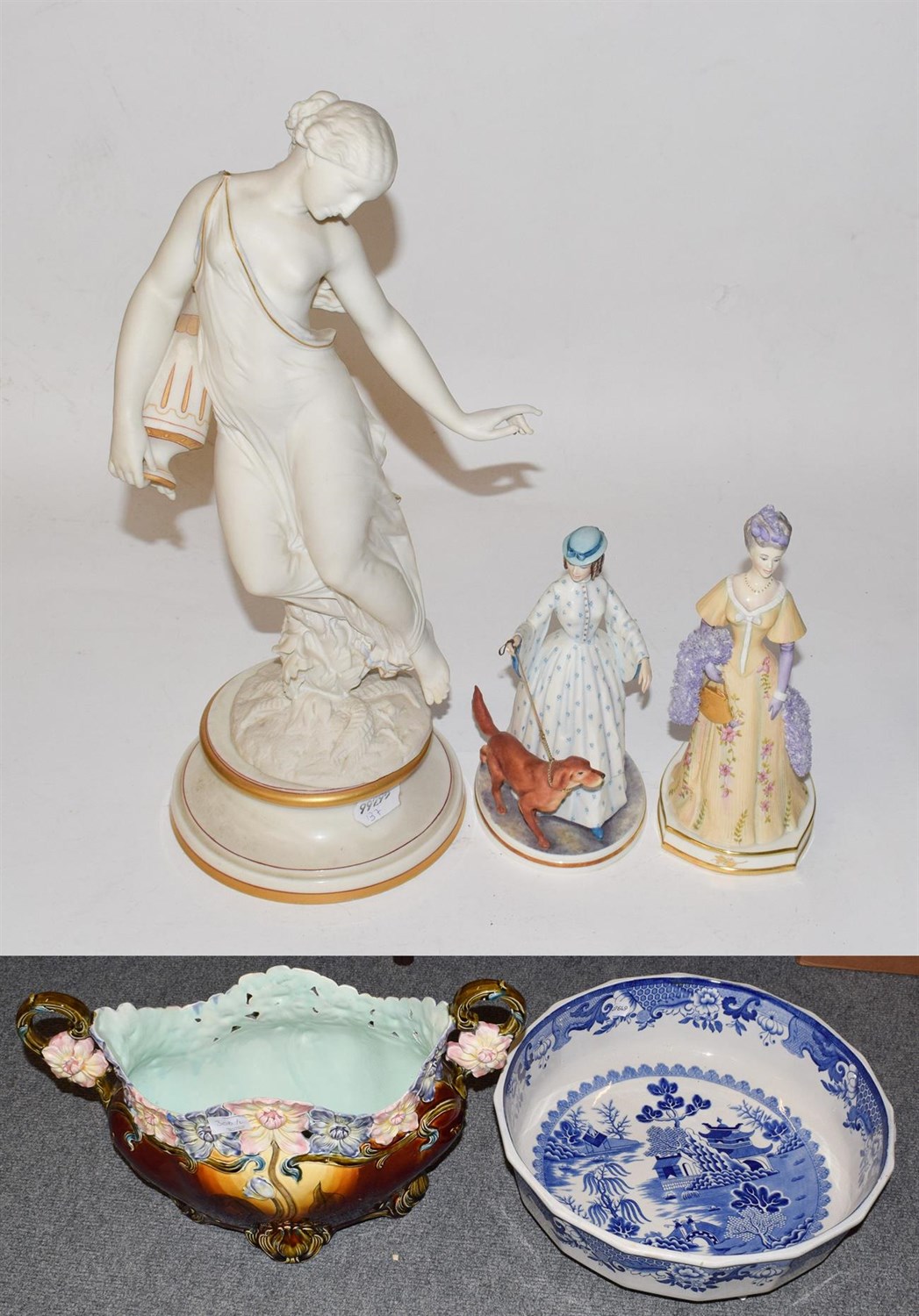 Lot 306 - A Royal Worcester model of a Classical maiden, 41cm high; together with two Royal Worcester...