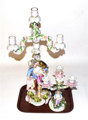 Lot 307 - A Continental porcelain figural candelabra bearing crossed sword mark, together with a larger...