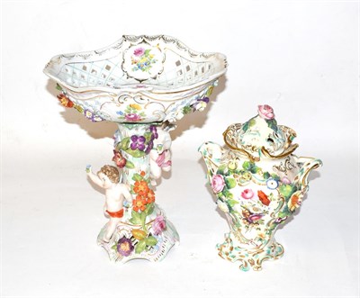 Lot 319 - A Dresden figural centrepiece, the pierced basket painted with flower and ribbon-tied swags,...