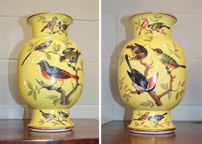 Lot 341 - A pair of late 19th/early 20th century German porcelain baluster vases, each painted with birds and