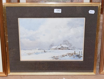 Lot 1062 - Ashton Connell, Snow bound landscape with cottage, watercolour, 25.5cm by 35.5cm