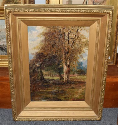 Lot 1086 - British School, 19th century, wooded landscape, indistinctly signed, oil on canvas, 60cm by 42cm