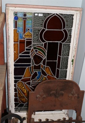 Lot 1109 - A mid 20th century coloured and leaded glass window depicting a Middle Eastern gentleman