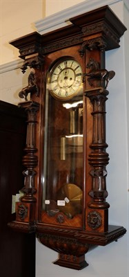 Lot 1110 - A walnut veneered Vienna style double-weight driven striking wall clock, with an unusually...