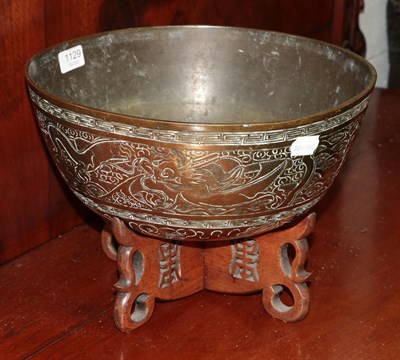 Lot 1129 - A 20th century brass Chinese punch bowl on stand