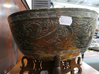 Lot 1129 - A 20th century brass Chinese punch bowl on stand