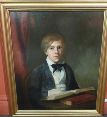 Lot 883 - English School (19th century) Portrait of a boy, seated beside a curtain reading a book Oil on...