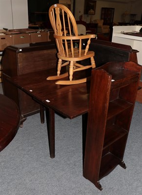 Lot 1166 - A 19th century mahogany drop-leaf table; a modern open bookcase; and a modern child's rocking chair