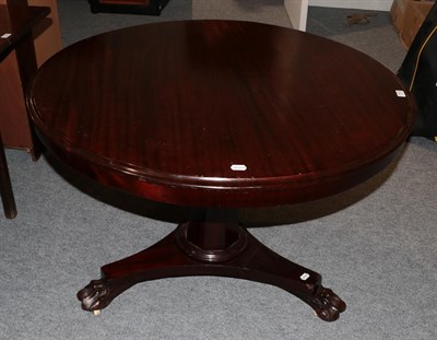 Lot 1167 - A 19th century circular topped mahogany pedestal table with tapering faceted standard on a...