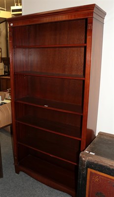 Lot 1168 - A modern mahogany open bookcase