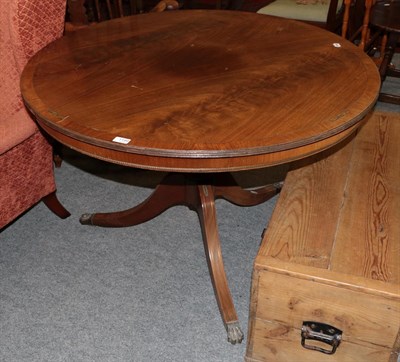 Lot 1199 - A brass inlaid mahogany tilt-top circular breakfast table, 106cm diameter by 73cm high
