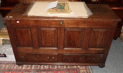 Lot 1212 - An 18th century panelled oak mule chest
