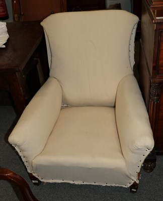Lot 1241 - A Howard style armchair (in need of re-upholstering)