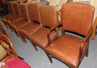 Lot 1245 - A set of six studded leather dining chairs, including one carver