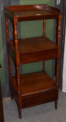 Lot 1260 - A Victorian mahogany three-tier whatnot, with wooden gallery, the bottom two tiers fitted with...