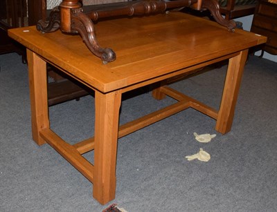 Lot 1272 - A modern golden oak farmhouse kitchen table, 136cm by 89cm by 75cm high