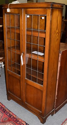 Lot 1279 - A lead glazed oak bookcase, 92cm by 29cm by 168cm high