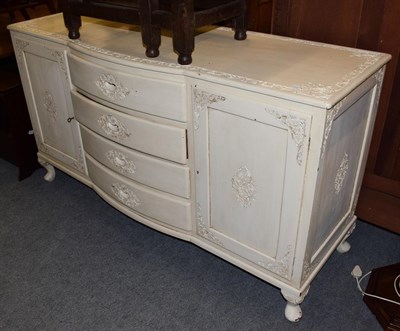 Lot 1302 - A French cream painted sideboard