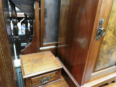 Lot 1305 - A group of furniture comprising an Edwardian inlaid mahogany mirror-fronted wardrobe; a walnut...