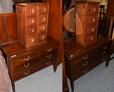 Lot 1307 - An Edwardian mahogany dressing table, a later mirror fronted wardrobe with matching dressing...