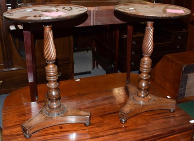 Lot 1319 - A pair of 19th century mahogany wine tables, the dish circular tops above turned standards over...