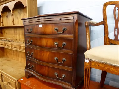 Lot 1331 - A pair of reproduction serpentine fronted bachelor chests