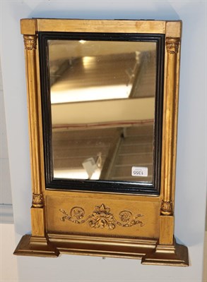 Lot 1355 - A Regency inverted brake-front gilt framed mirror with ebonised slip