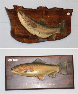 Lot 1357 - Two painted carved models of a rainbow trout, mounted on plaques
