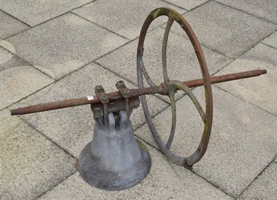 Lot 1360 - A large church bell and wheel