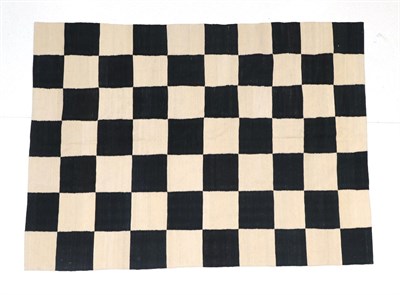 Lot 194 - Hand-woven Modernist flatweave, the ink black and cream field of chequer-board design, 232cm by...