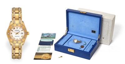 Lot 2159 - A Lady's 18 Carat Gold Diamond Set Automatic Calendar Centre Seconds Wristwatch, signed Rolex,...