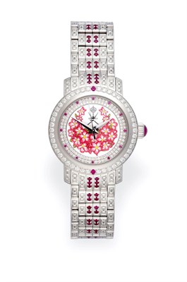 Lot 2185 - A Lady's 18 Carat White Gold Diamond and Ruby Set Automatic Centre Seconds Wristwatch, retailed...